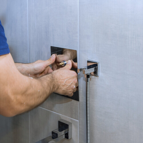 new shower fixtures being installed